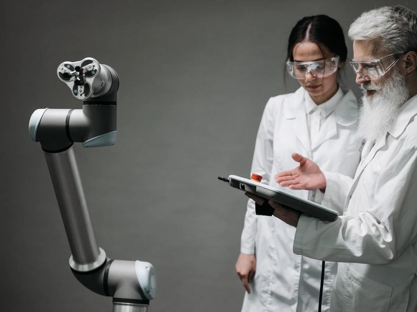 Robotics researchers evaluating a collaborative robot