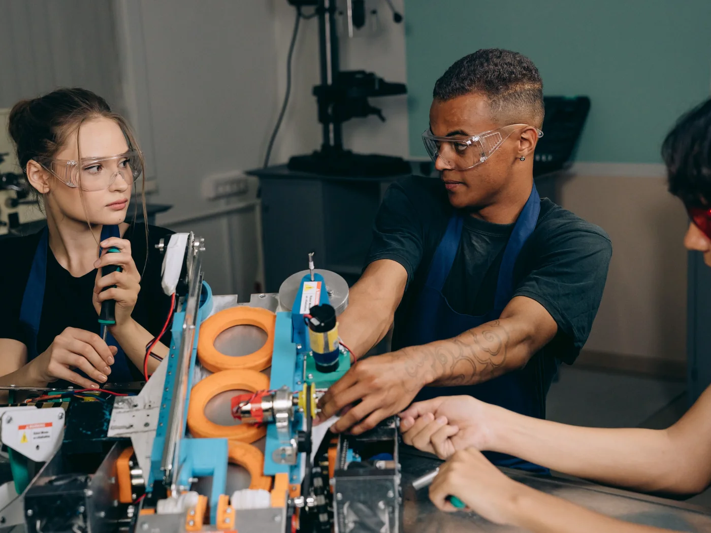 Robotics engineers working in a workshop